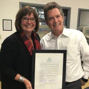 November 2019 - Susan receiving a resolution recognizing her 20 years of dedicated service from TCF Board Chair Jeff Gonnason.
